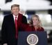 Rep. Marjorie Taylor Greene, R-Ga., speaks as President Donald Trump listens at a campaign rally in support of Senate candidates Sen. Kelly Loeffler, R-Ga., and David Perdue in Dalton, Ga., Monday, Jan. 4, 2021. (AP Photo/Brynn Anderson)