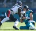 Jaguars quarterback Trevor Lawrence slides down in front of Texans linebacker, Azeez Al-Shaair before taking a hard hit; USA TODAY Sports via Reuters